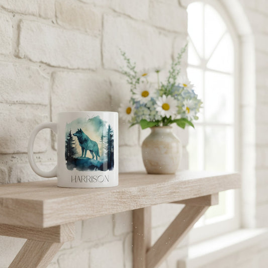 Mug with wolf design and 'HARRISON' branding on a wooden shelf with flowers.