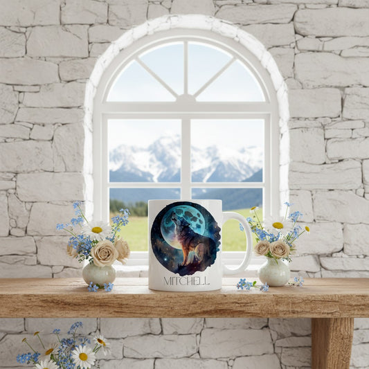 Mug with wolf design on a wooden table with flowers, against a stone wall and window backdrop.