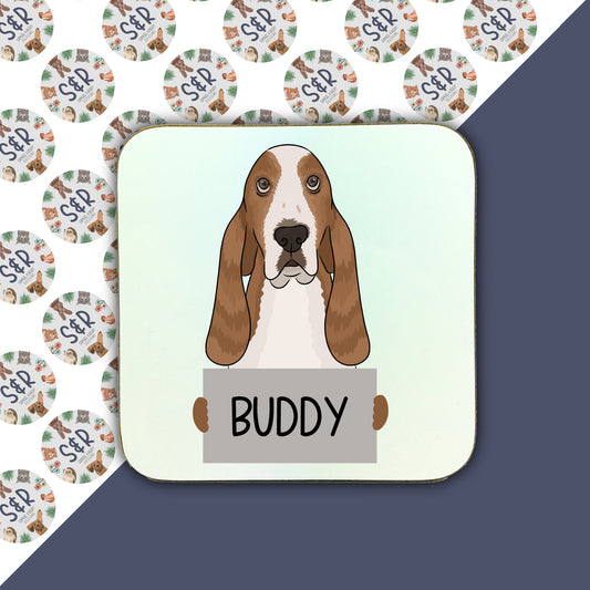 A square coaster with an illustration of a basset hound dog with the name 'Buddy' written on it.