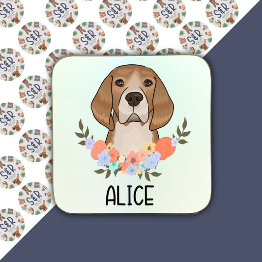 A square coaster with a illustration of a beagle dog surrounded by a floral pattern.