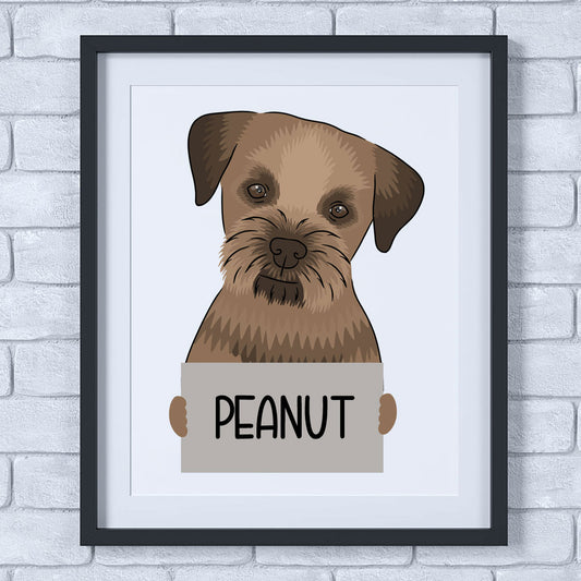 A framed poster of a Border Terrier dog with the text 'PEANUT' next to it, displayed on a wall.