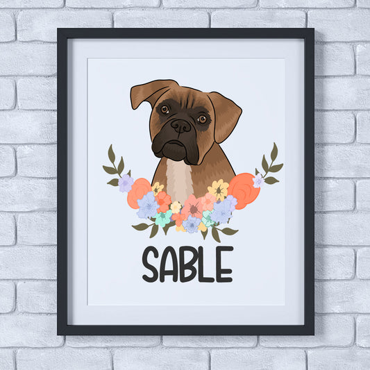 A framed poster of a boxer dog with a floral pattern in the background.