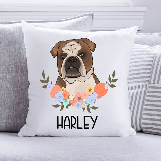 A square cushion with a white background featuring a printed image of a bulldog in the centre surrounded by a floral pattern. The cushion has the text 'Harley' at the bottom.