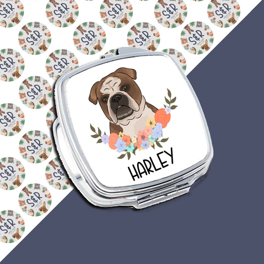 A personalised compact mirror with a bulldog illustration and floral design on the front, with the name 'Harley' printed on the side.