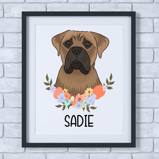 A framed poster of a Bullmastiff dog with a floral wreath and the name 'Sadie' printed below.