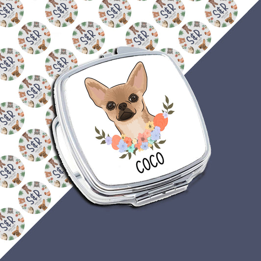 A compact mirror with a personalised design featuring a cartoon chihuahua dog illustration on the front, surrounded by a floral pattern, with the name 'Coco' underneath the image.