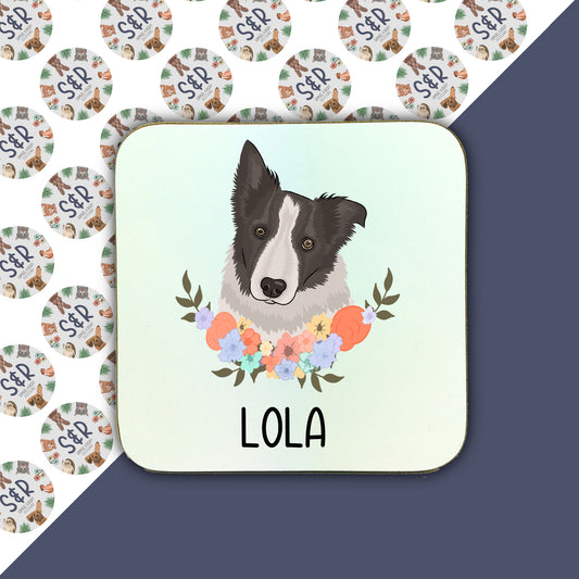 A square coaster with a colourful floral border and a central illustration of a Border Collie dog. The coaster has the name 'LOLA' written on it.