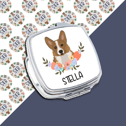 A personalised compact mirror with a corgi dog design and the name 'Stella' printed on the front.