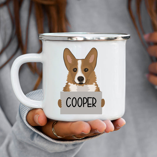 A white enamel mug with a cartoon corgi dog illustration and the name 'Cooper' printed on the side.