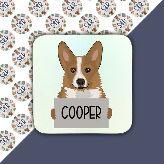 A square coaster with a glossy finish featuring an illustration of a Corgi dog with the name 'COOPER' printed on it.