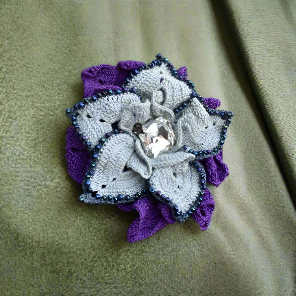 purple brooch