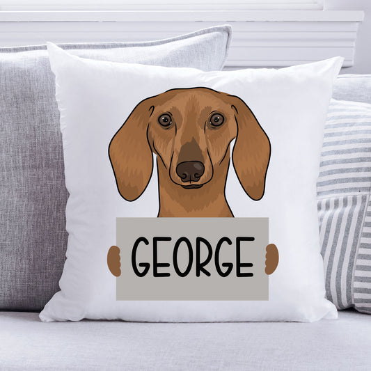A personalised square cushion with a printed dachshund dog design in the centre, with the name 'George' below it.