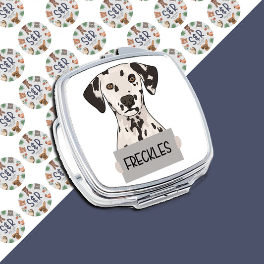 A personaliSed compact mirror with a sublimated design of a Dalmatian dog on the front, with the name 'Freckles' below the image.