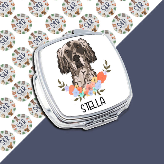 A personalised compact mirror with an image of an English Setter dog and floral design, with the name 'Stella' printed on the front.
