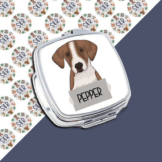 A compact mirror with a personalised message that reads 'PEPPER' on the front, featuring an illustration of a foxhound dog inside.