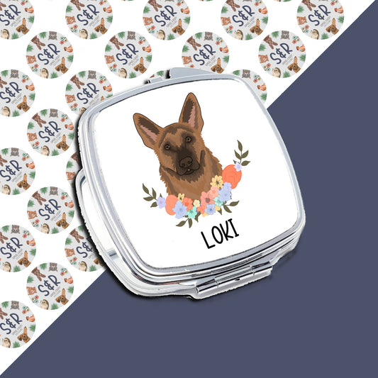 A personalised compact mirror with a German Shepherd dog illustration and the name 'Loki' on the front.