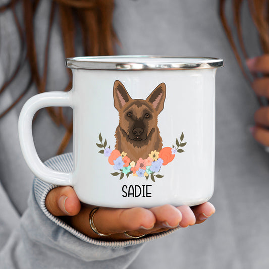 A white enamel mug with a printed image of a German Shepherd dog surrounded by a floral wreath, with the name 'SADIE' at the bottom.