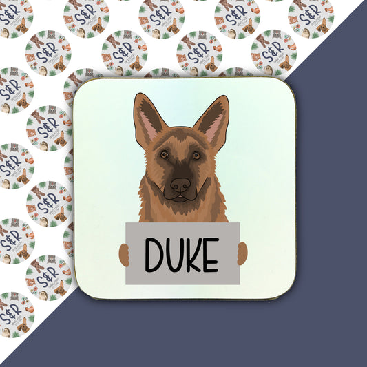 A square coaster with a personalised illustration of a German Shepherd dog with the name 'Duke' below it.