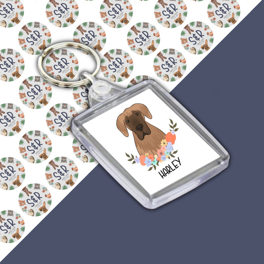 A clear acrylic keyring with a personalised illustration of a dog, branded with 'Samuel & Rigby Designs'.