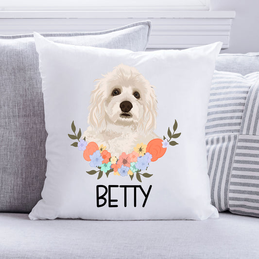 A square-shaped chair cushion featuring an illustration of a Havanese dog in the centre with a floral pattern around it.