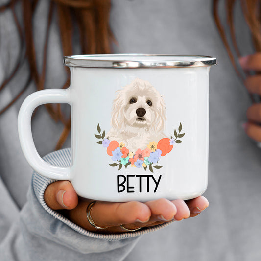 A white enamel mug with a printed image of a Havanese dog breed, surrounded by a floral pattern.