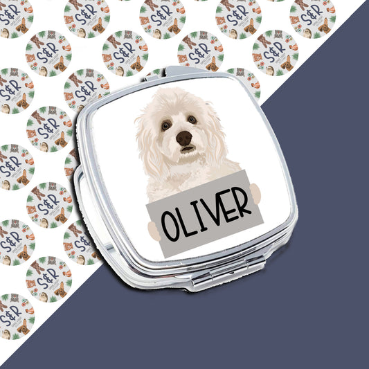 A personalised compact mirror with an image of a Havanese dog on the front, with the name 'Oliver' printed below the image.