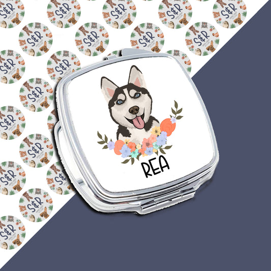 A personalised compact mirror with a sublimated design of a husky dog surrounded by colourful flowers on the front.