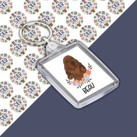 A clear acrylic keyring with a double-sided design featuring an illustration of an Irish Setter dog on a branded Samuel & Rigby designs backing card.