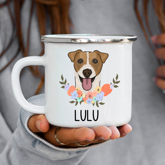 A white enamel mug with a colourful illustration of a Jack Russell dog with a flower in its mouth, surrounded by a floral pattern.