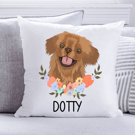 A square-shaped cushion with an illustration of a Pekingese dog in the center, surrounded by a floral pattern.