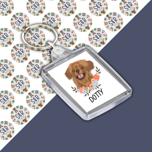 A personalised keyring featuring an illustration of a Pekingese dog with a floral pattern in the background.