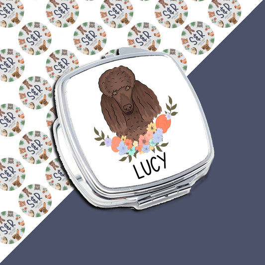 A personalised compact mirror with a poodle dog design, custom text 'LUCY' on the front, surrounded by a pattern of similar mirrors with floral designs.