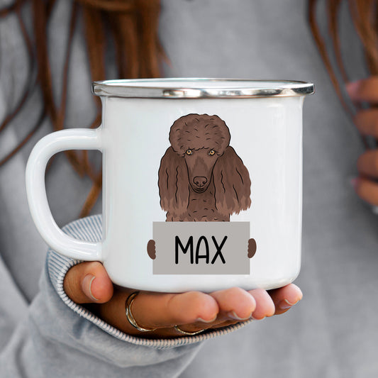 A white ceramic mug with a brown illustration of a poodle dog, held in a person's hand.