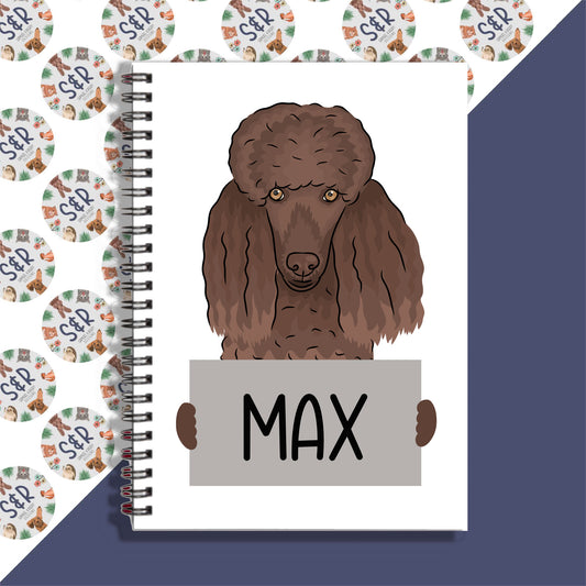 A personalised poodle-themed notebook with a spiral binding. The notebook features a graphic of a poodle on the front cover and is labeled with the name 'Max'.