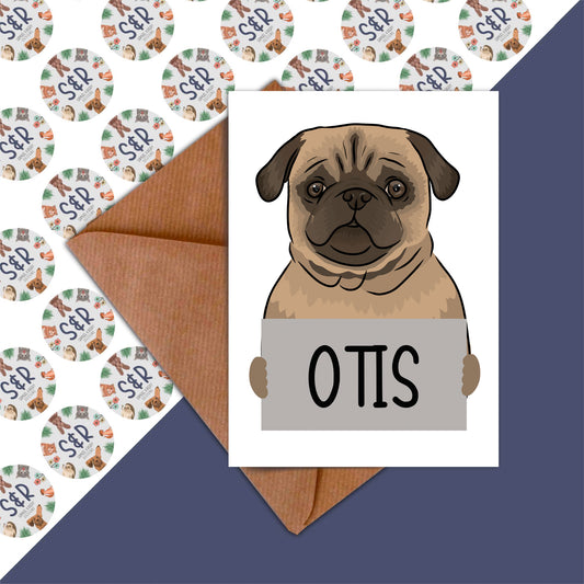 A handmade greeting card featuring an illustration of a pug dog with the name 'Otis' printed on the front, along with a brown manilla envelope.