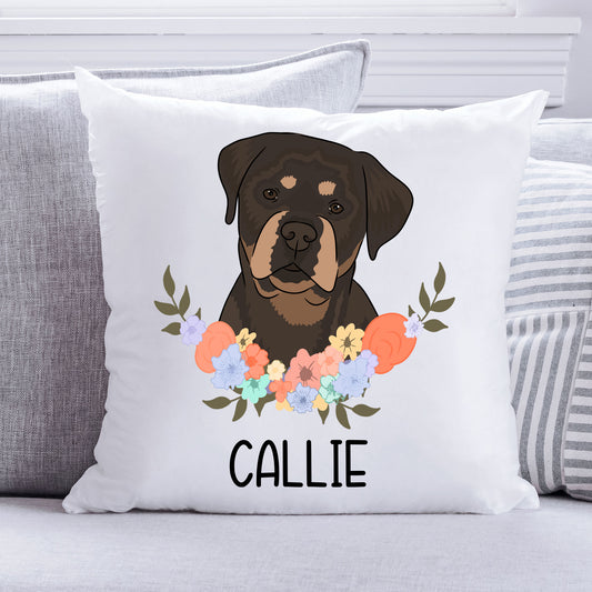 A square-shaped cushion with a printed image of a Rottweiler dog surrounded by a floral pattern on a white background. The cushion has a white zippered cover with the name 'Callie' printed on it.