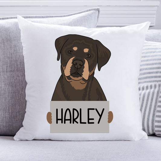 A square-shaped, white personalised pet cushion with a printed image of a Rottweiler dog and the name 'Harley' below it.