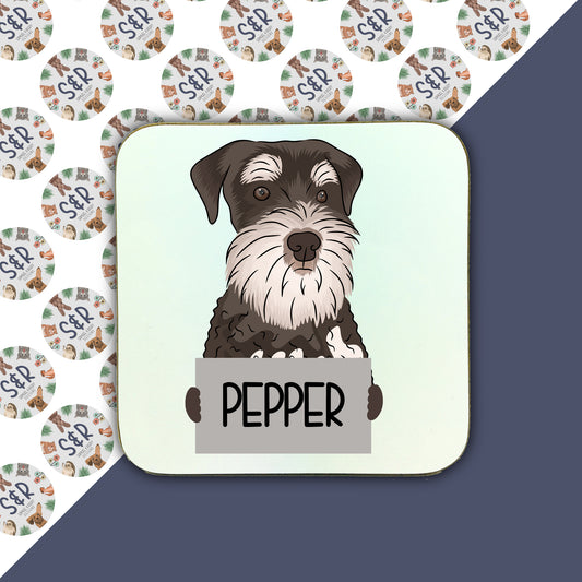 A square coaster with a cartoon illustration of a Schnauzer dog and the word 'PEPPER' below it.