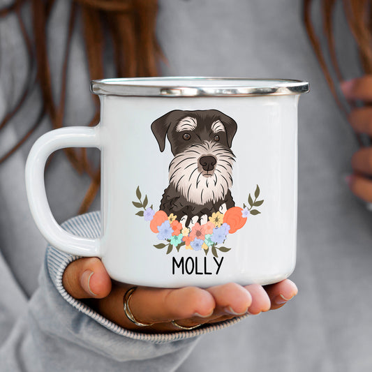 A white enamel mug with a colourful floral design and a cartoon image of a Schnauzer dog in the center. The mug has the name 'Molly' printed on the front.