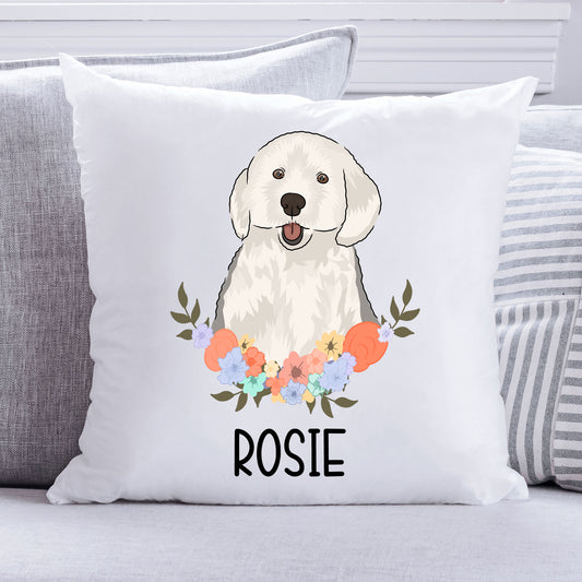 A personalised cushion featuring an illustration of an English Sheepdog in the center with a floral pattern around it, on a white background.
