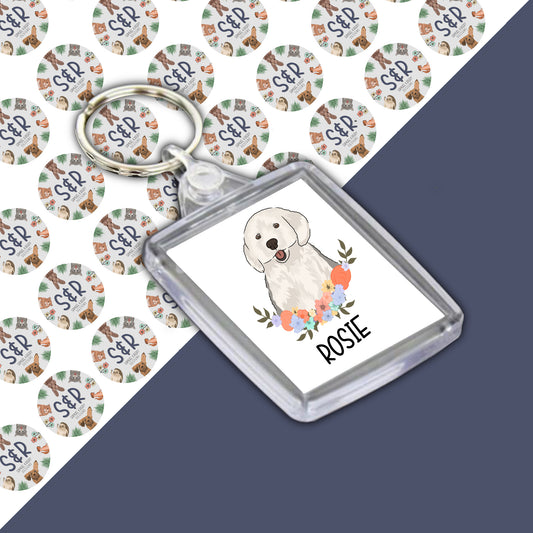 A personalized double-sided acrylic keyring with an image of an English Sheepdog on the front, with the name 'Rosie' included on the keyring.