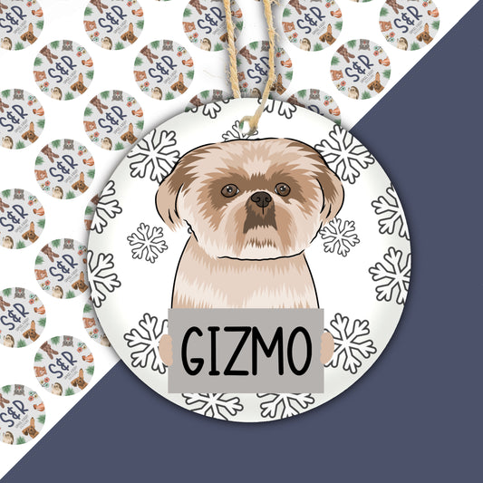 A ceramic Christmas decoration featuring a Shih Tzu dog design with the text 'Gizmo' on it.