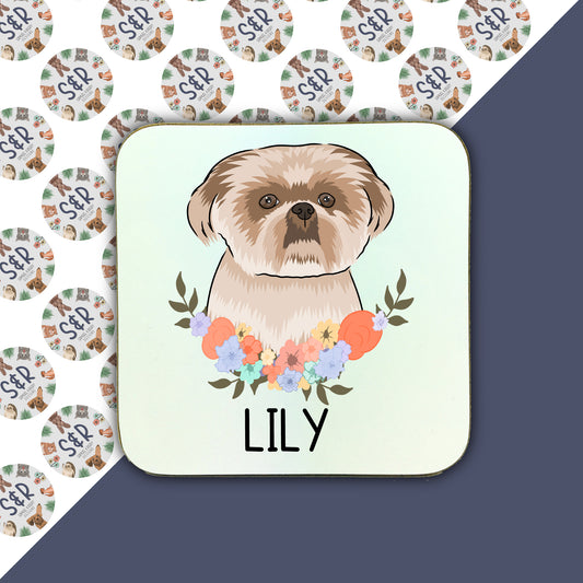 A square coaster with a colourful floral design and an illustration of a Shih Tzu dog in the center.