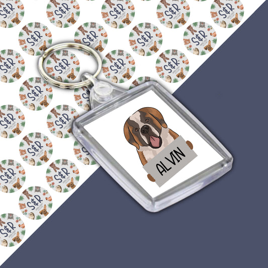 A personalised keyring featuring an image of a Saint Bernard dog, encased in a clear acrylic casing, with the name 'Alvin' printed on the keyring.