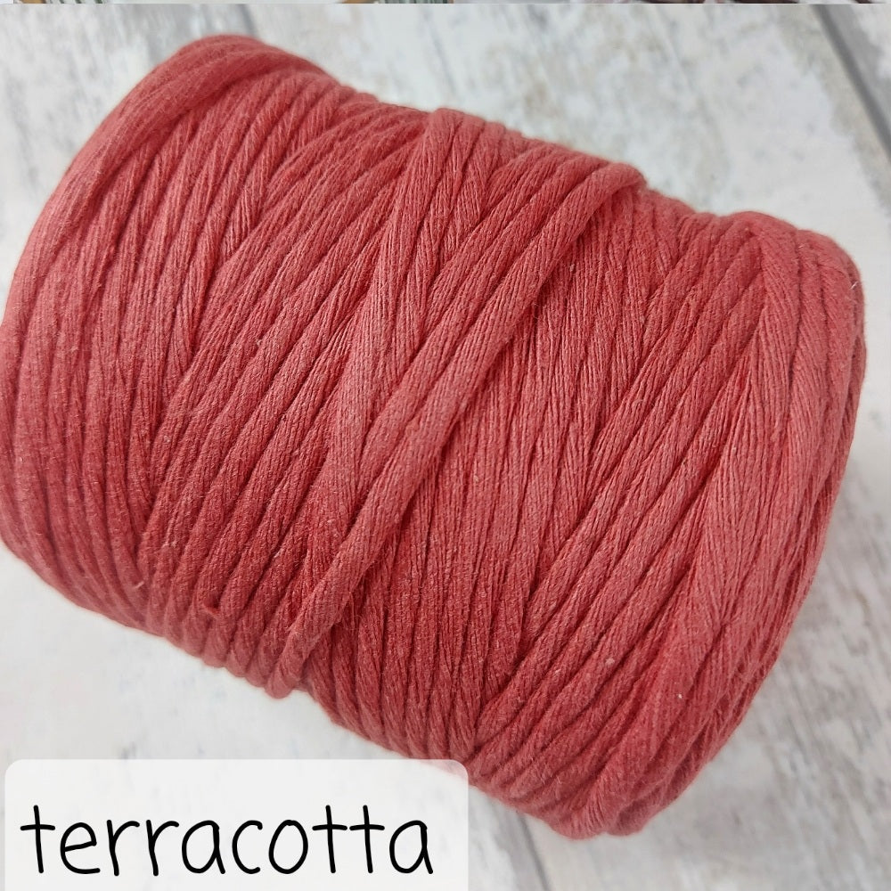 Close up image of terracotta macrame rope