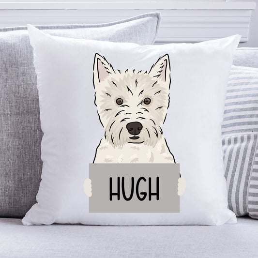 A personalised cushion featuring a Westie dog design with the name 'HUGH' printed on it, placed on a sofa.