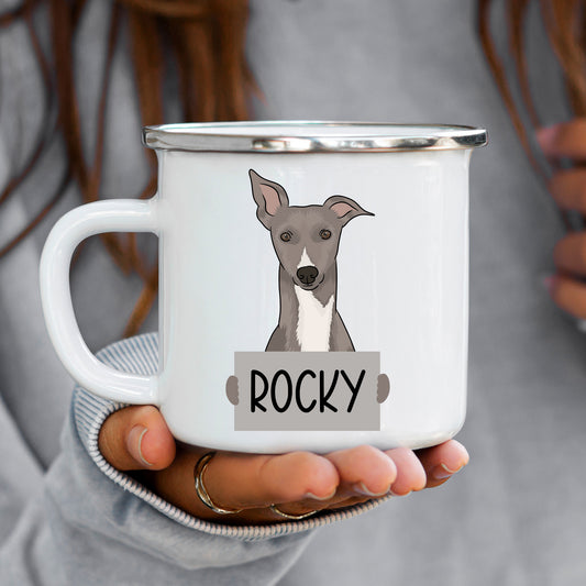 A white ceramic enamel mug with an illustration of a whippet dog and the name 'Rocky' printed on it.