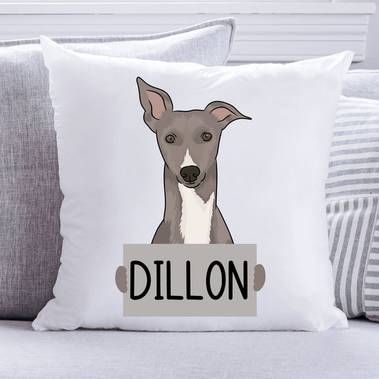 A square-shaped, white personalised pet cushion featuring an illustration of a whippet dog with the name 'Dillon' printed on it.
