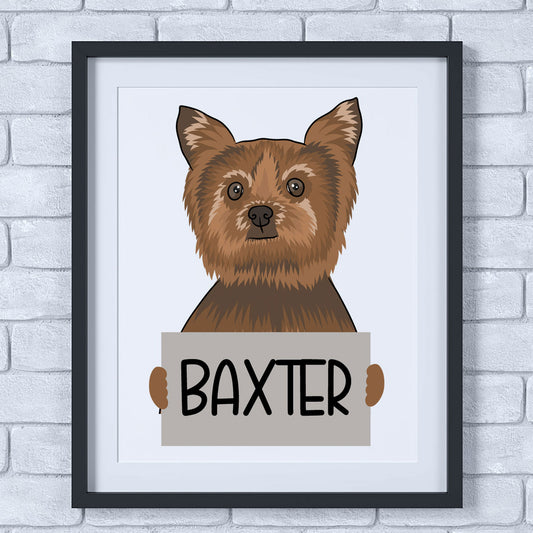 A colourful illustration of a Yorkshire Terrier dog with a sign that reads 'Baxter', held in a frame.